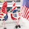 Glitzhome® Set of 2 Patriotic Americana Polyresin Gnomes with Dangling Legs Table Decor